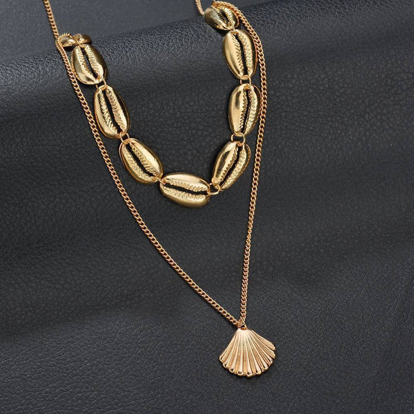 Choker Halskette mit goldenen Kauri Muscheln im Layer Look