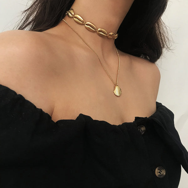 Choker Halskette mit goldenen Kauri Muscheln im Layer Look